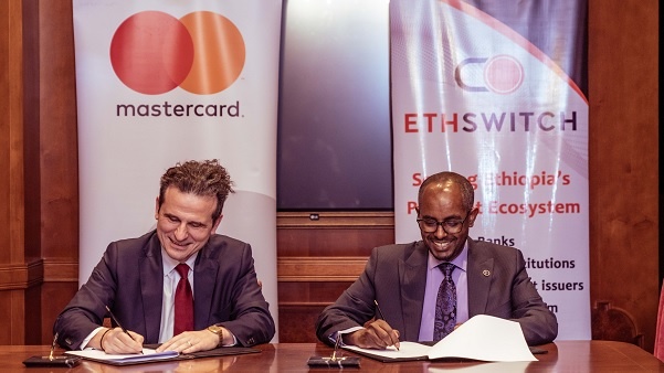 Mastercard's Dimitrios Dosis and EthSwitch's Yilebes Addis during the signing ceremony (PHOTO: Mastercard)